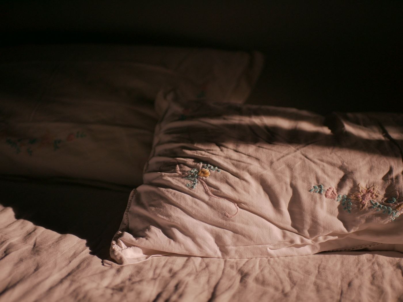 Close Up Photo of Pillows on a Bed