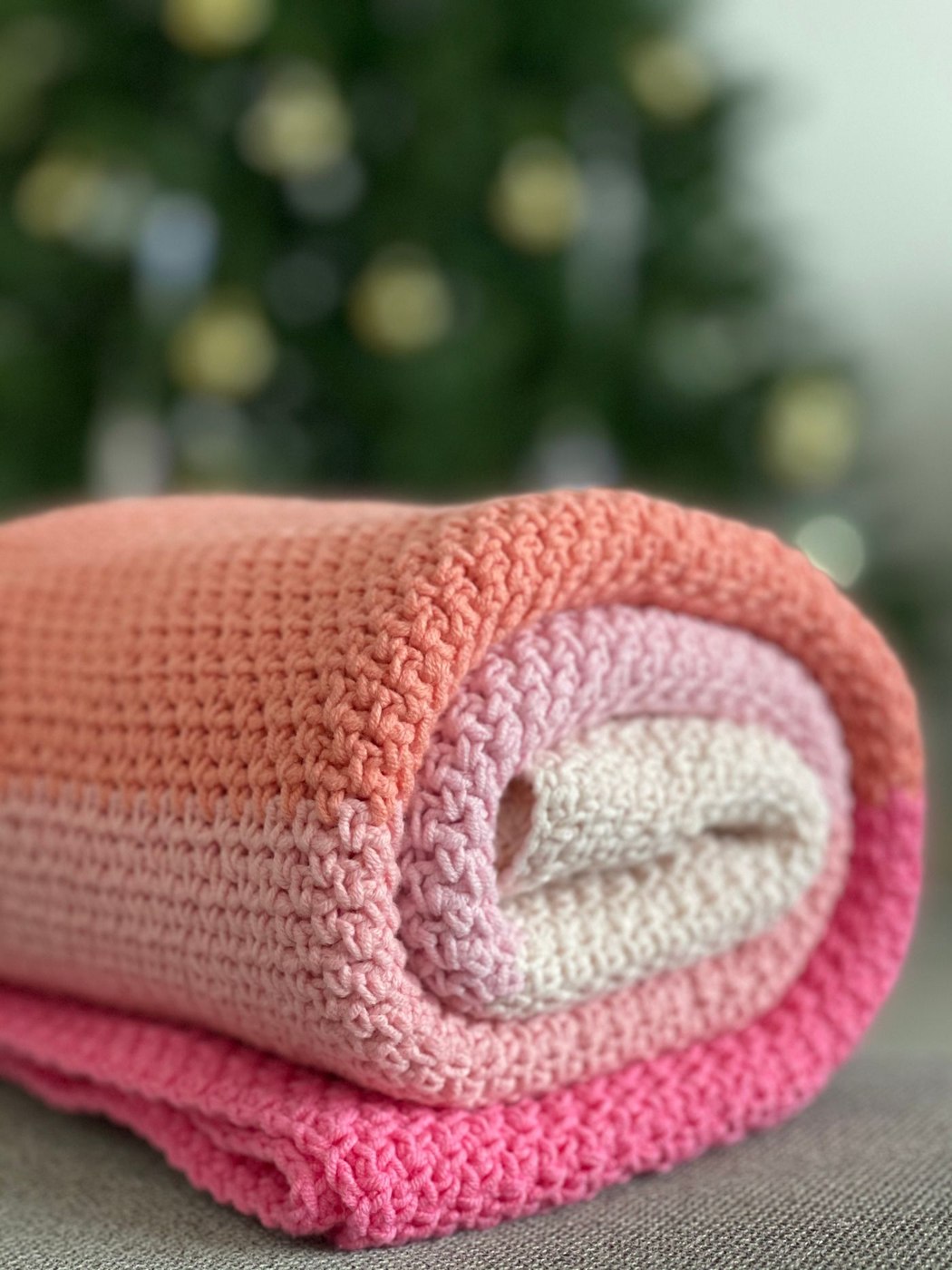 A rolled crochet blanket