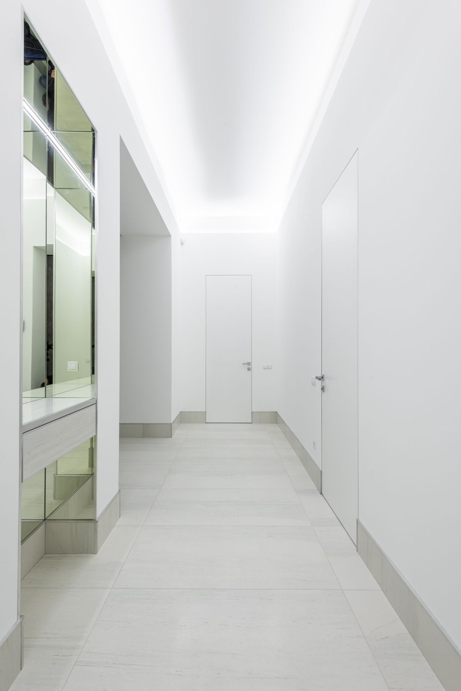 Light corridor with white doors