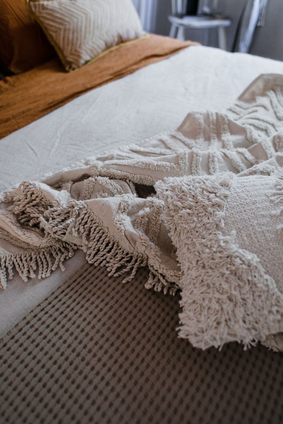 White Knitted Textile on White and Brown Linen