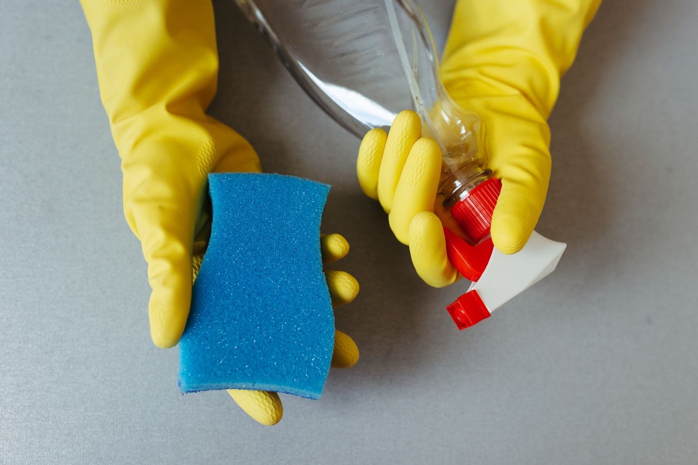 Close-up of Cleaning Supplies with Gloves
