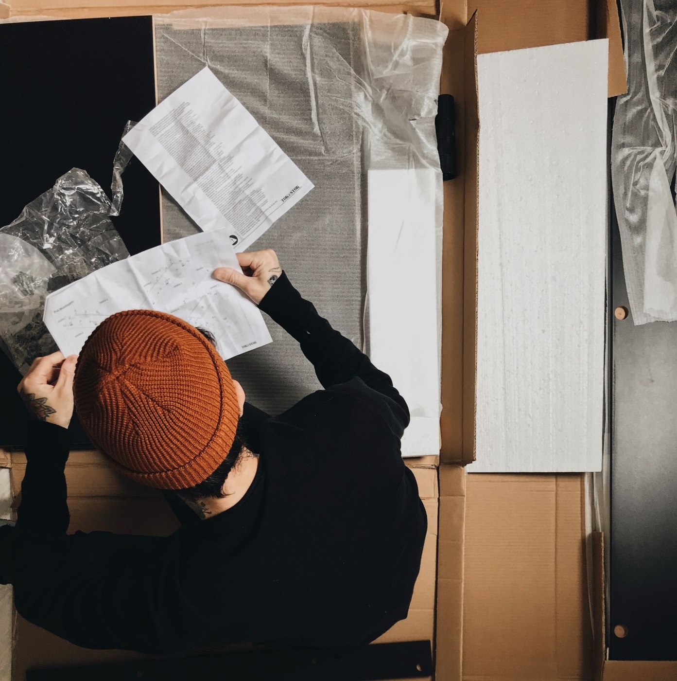 Man Reading a Instruction Manual