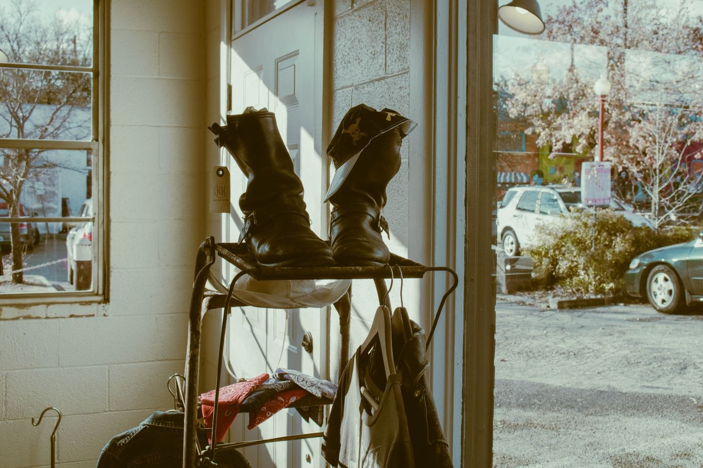 Brown Leather Boots on Rack Near Doorway