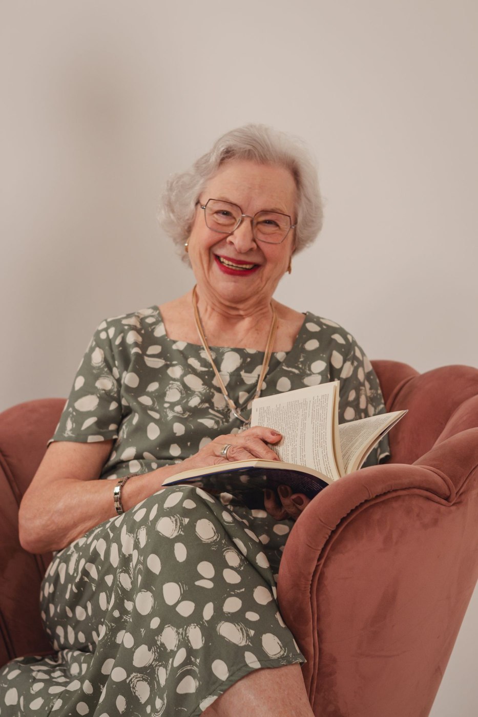 Senior woman enjoying a good book indoors