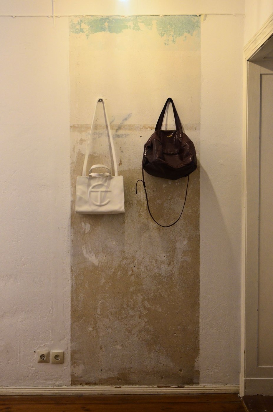 Bags hanging on wall at home