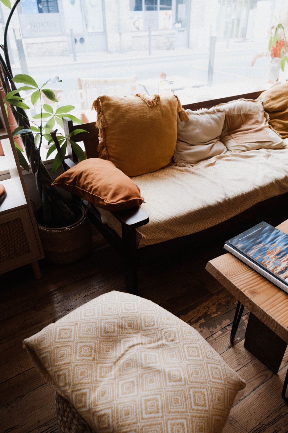 Sofa with Pillows by the Window in the Living Room