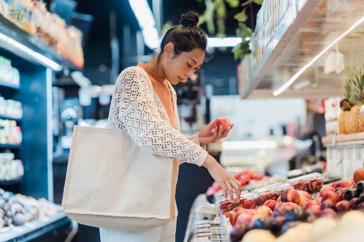 Woman Buying Fruits in a Supermarket