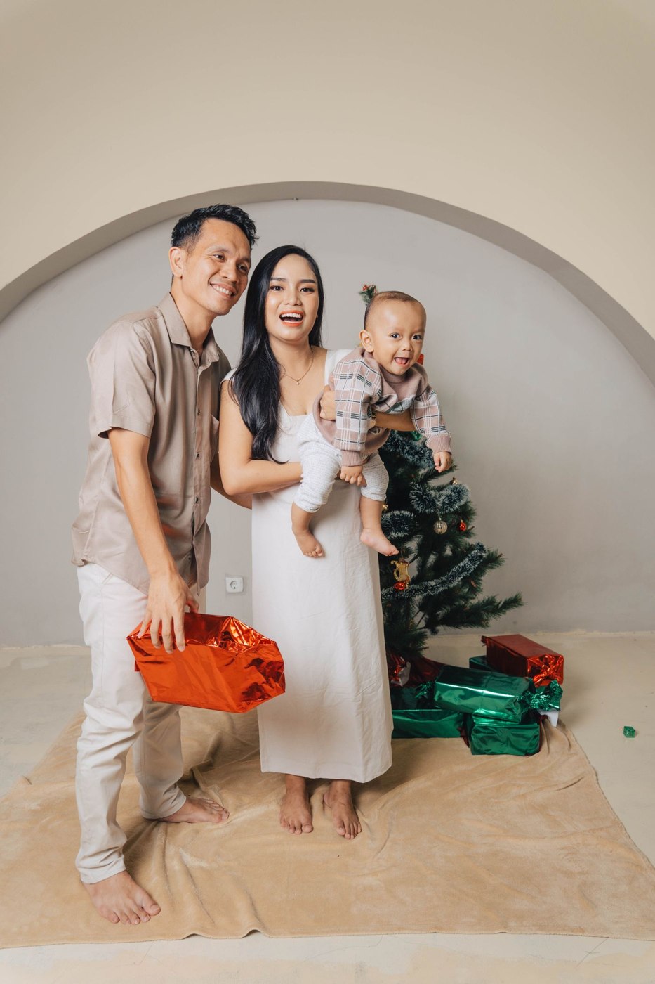 Happy Family Celebrating Christmas at Home