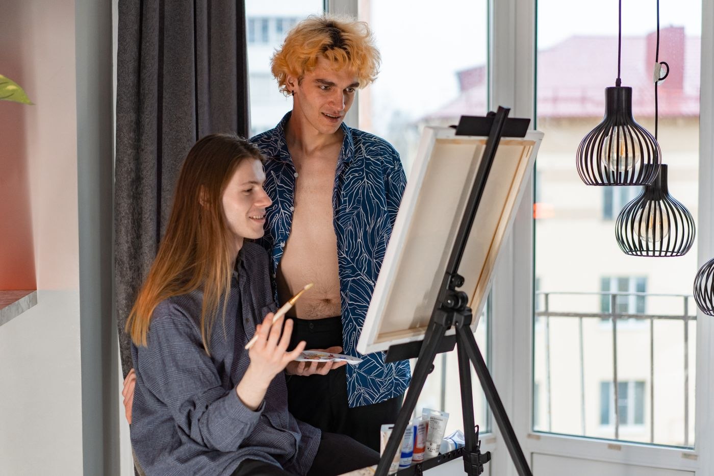 A Couple Painting on a Canvas